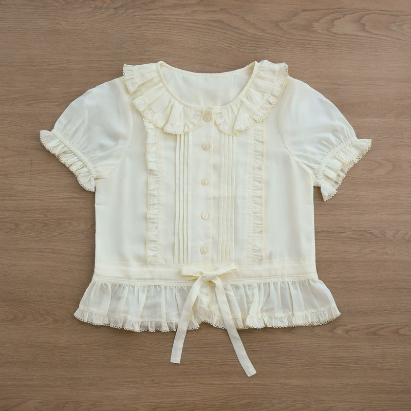 Ivory Sweet Lolita shirt with a ruffled Peter Pan collar, pintucks, and short sleeves.
