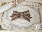 Barrette-broche à nœud rayé double usage