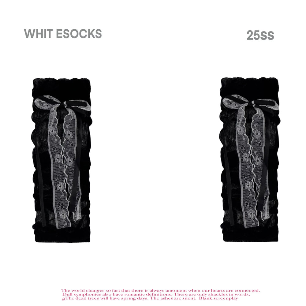 Close-up styling of thin gathered socks with vertical stripe texture and ribbon ties.