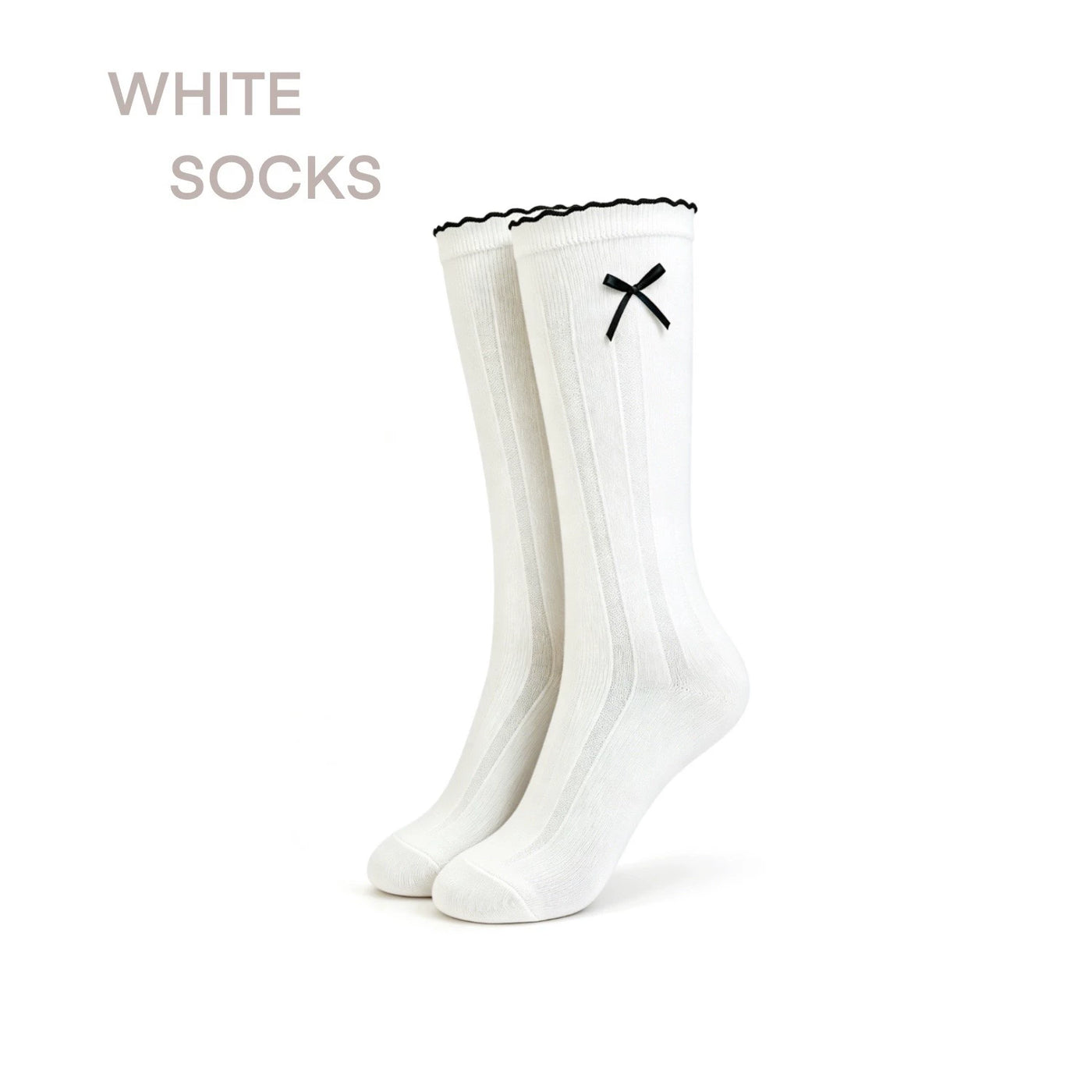 White mid-calf socks with black three-stripe cuffs styled with black bow shoes.