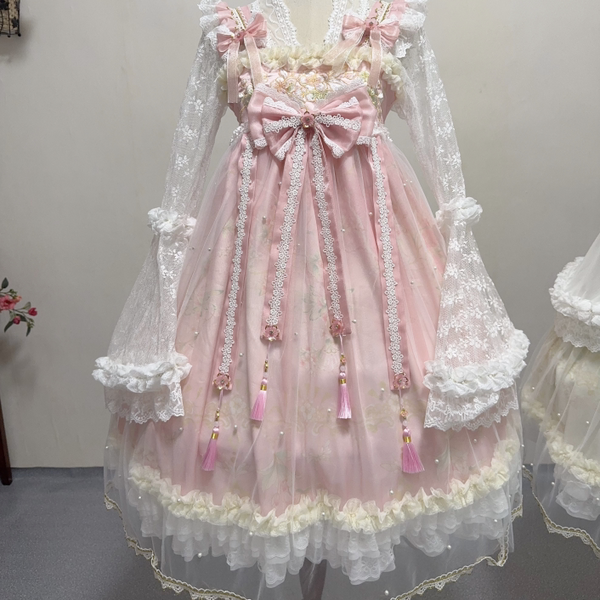 Pink and green Youliji JSK dresses with floral details, lace trims and bows displayed on mannequins.