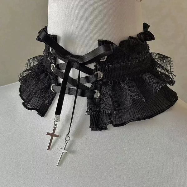 Black lace neckwear with criss-cross straps and dangling cross charms.
