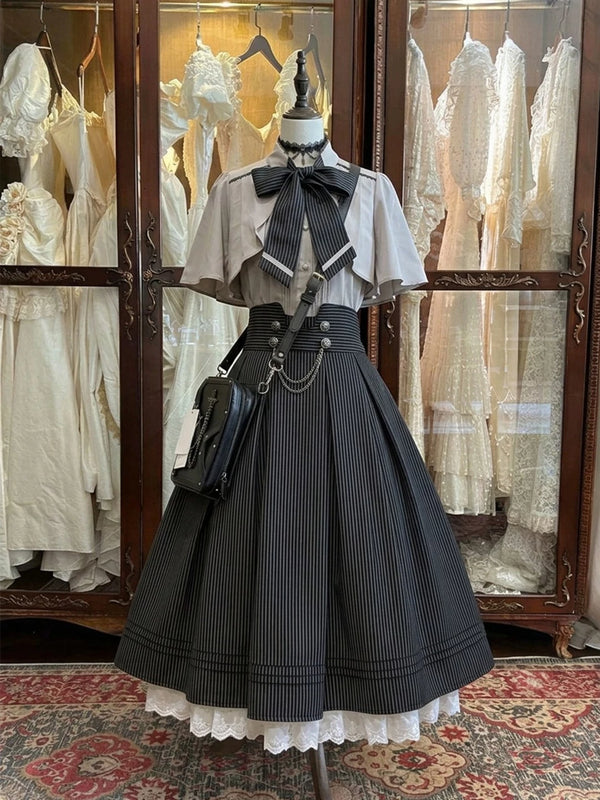 Creamy gray blouse and pinstriped high-waisted skirt set on a mannequin