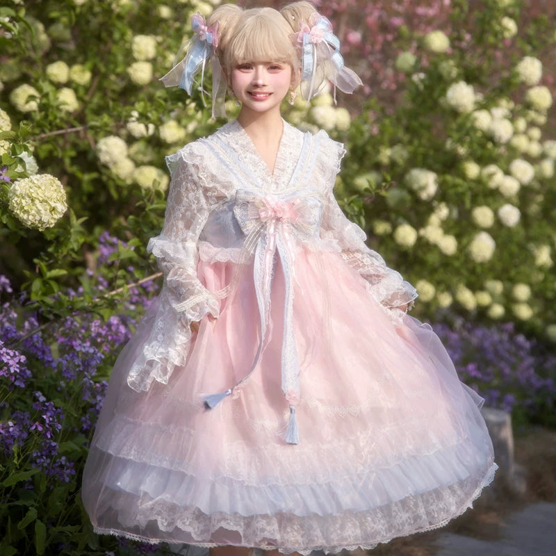Lady Han Peach Spring Chinese JSK dress by Lolita Fetch featuring a pastel peach-colored fabric with floral patterns and bow details.