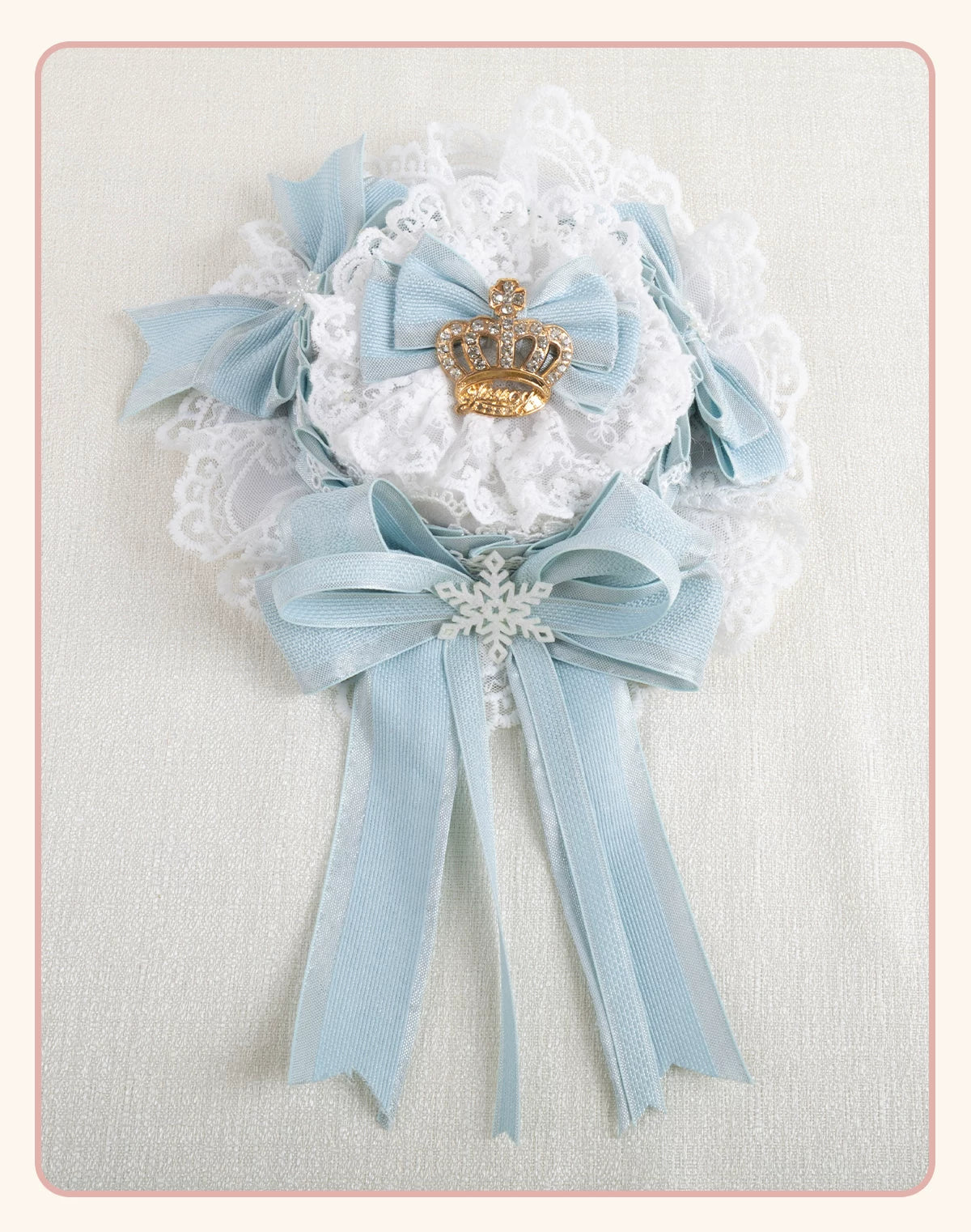 Light-blue bow and white lace headwear with crown and snowflake accents