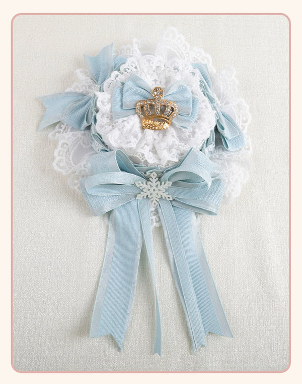 Light-blue bow and white lace headwear with crown and snowflake accents