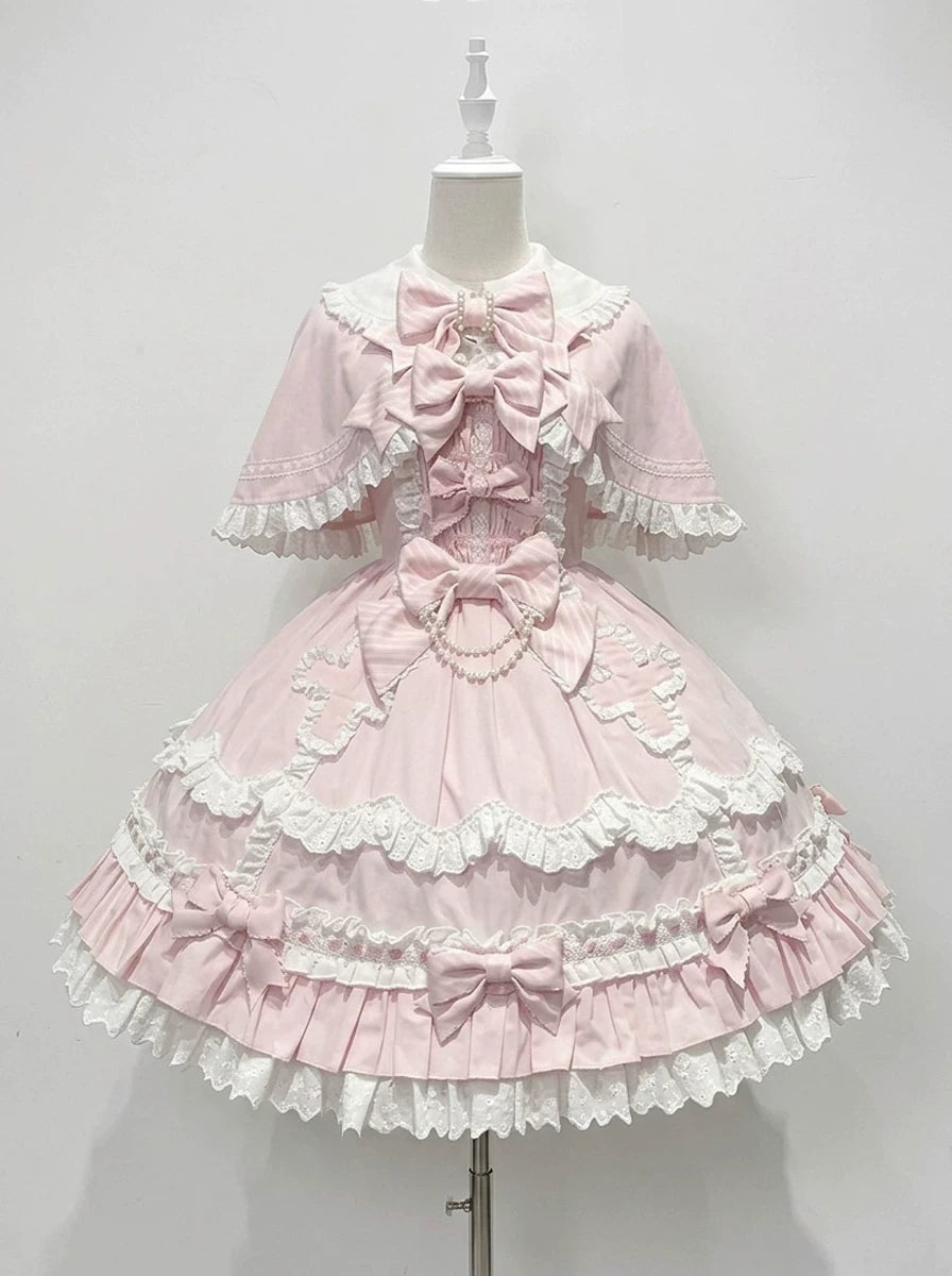Pale pink bow and lace JSK dress with cape on a mannequin