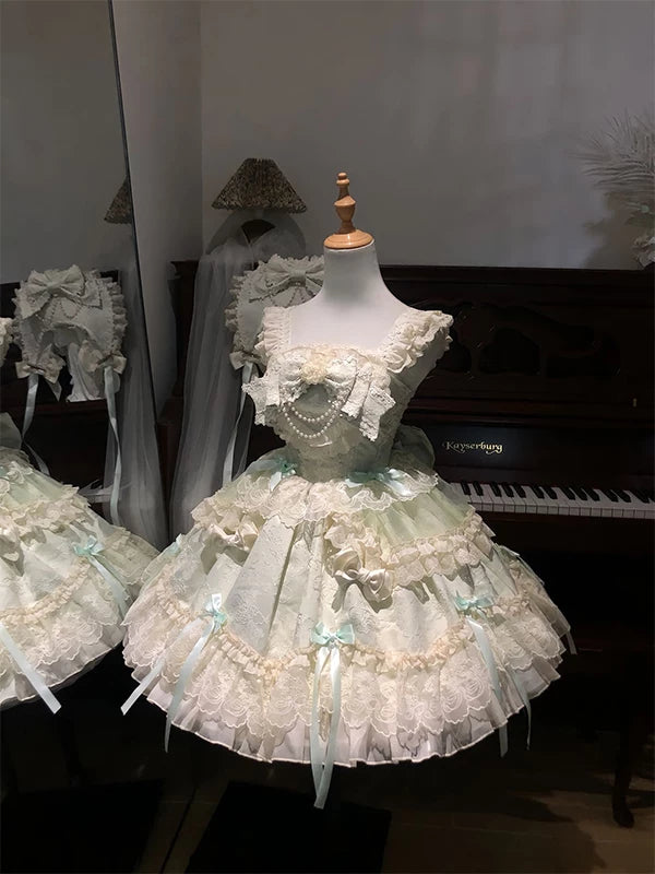 Green Lolita JSK camisole dress with tiered skirt and lace trim on mannequin