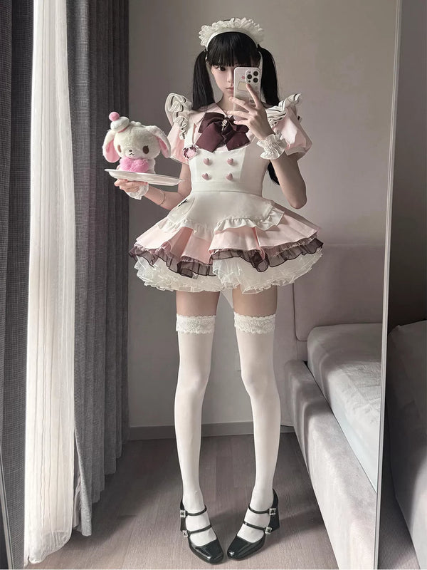 White-and-pink one-piece Lolita dress with a maid apron, ruffled sleeves and layered skirt.