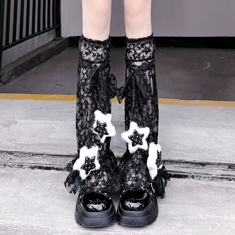 Floral Milk Cat lace leg warmers with star accents shown in black and white colourways.