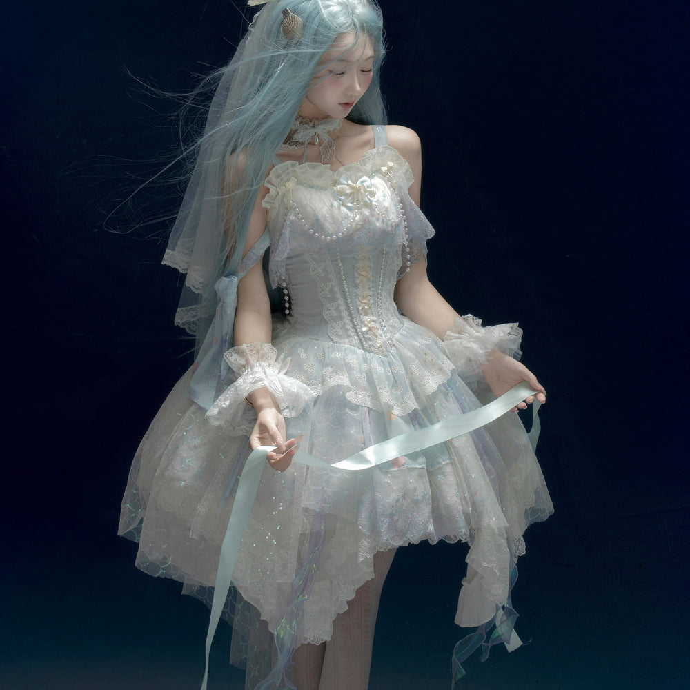 Pale blue lace JSK with veil and pearl details worn in an editorial setting