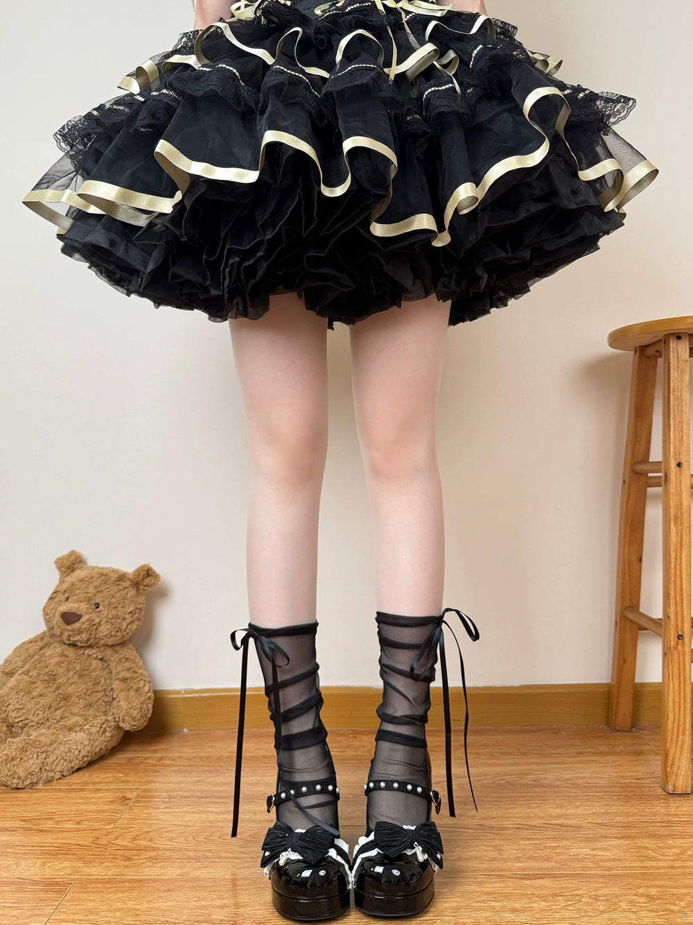 Sheer mid-calf socks shown in black and white with long ribbon ties.