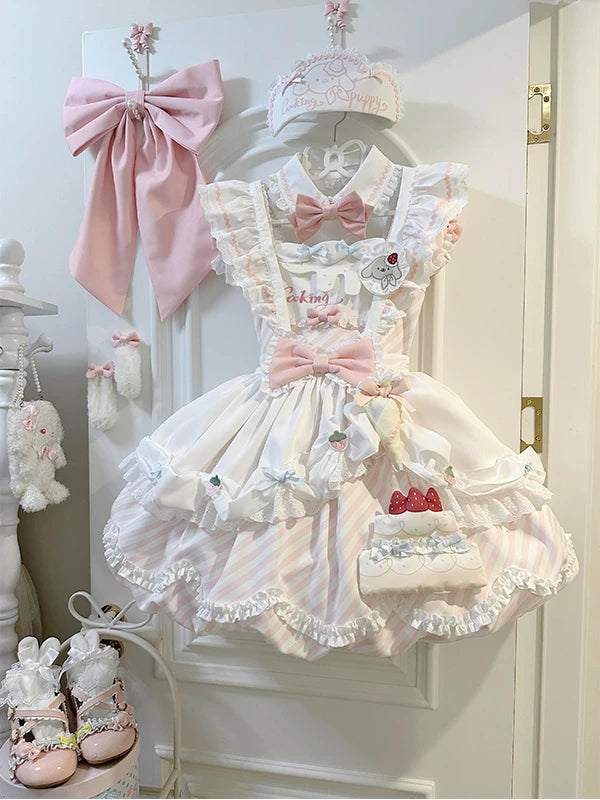 Pink-and-white striped Lolita dress set with ruffled apron and cake accessory hanging on display.