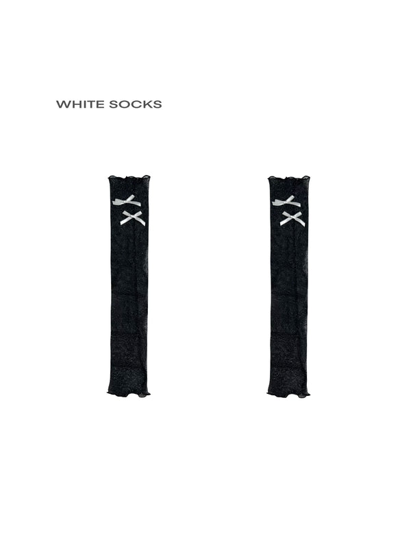 White Socks black sheer mesh calf leg warmers with white bow accents.