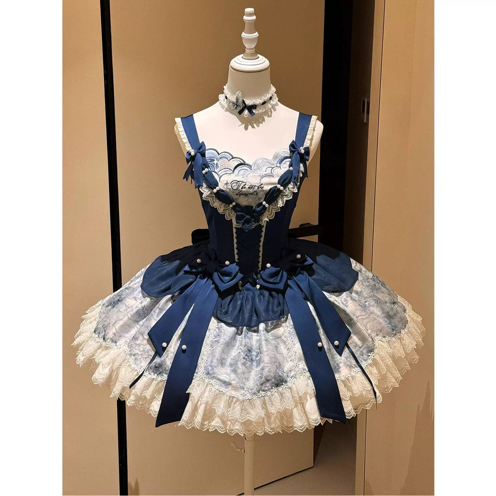 Navy-and-white OP dress with blue bows and layered lace ruffles displayed on a mannequin