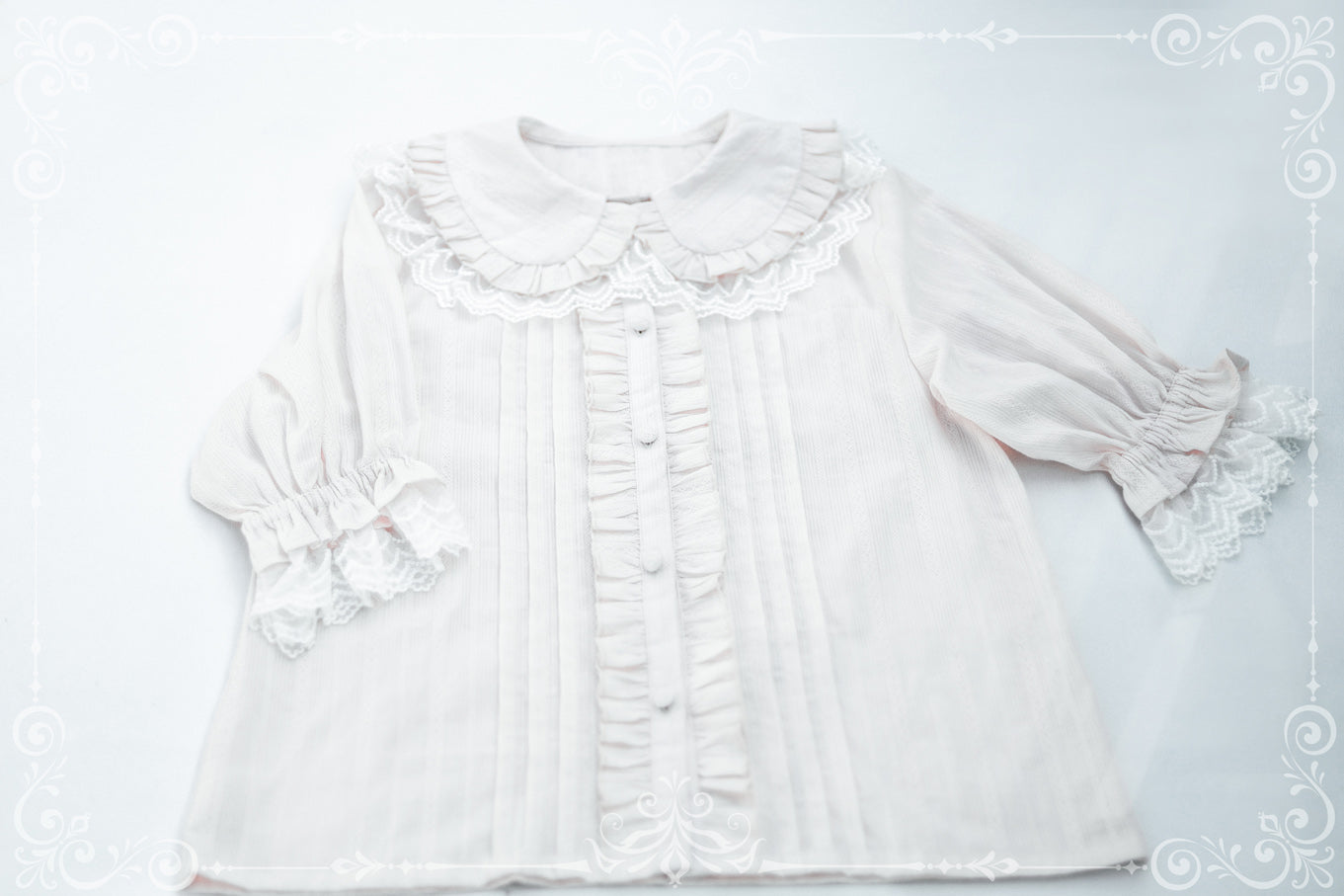 White short-sleeve Lolita shirt with a ruffled collar and front placket