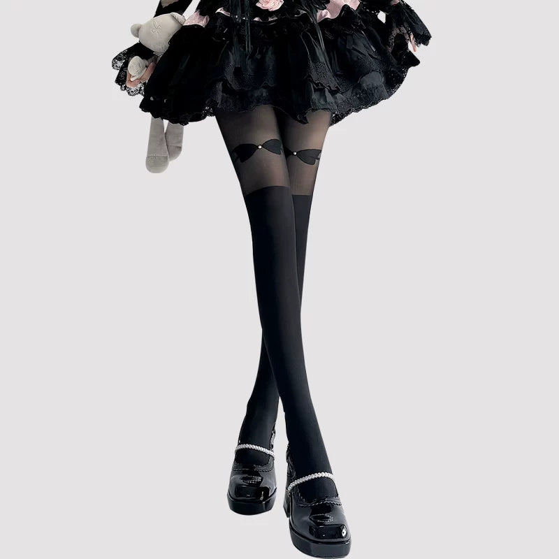 Black and ivory panelled pantyhose with bow details shown on models