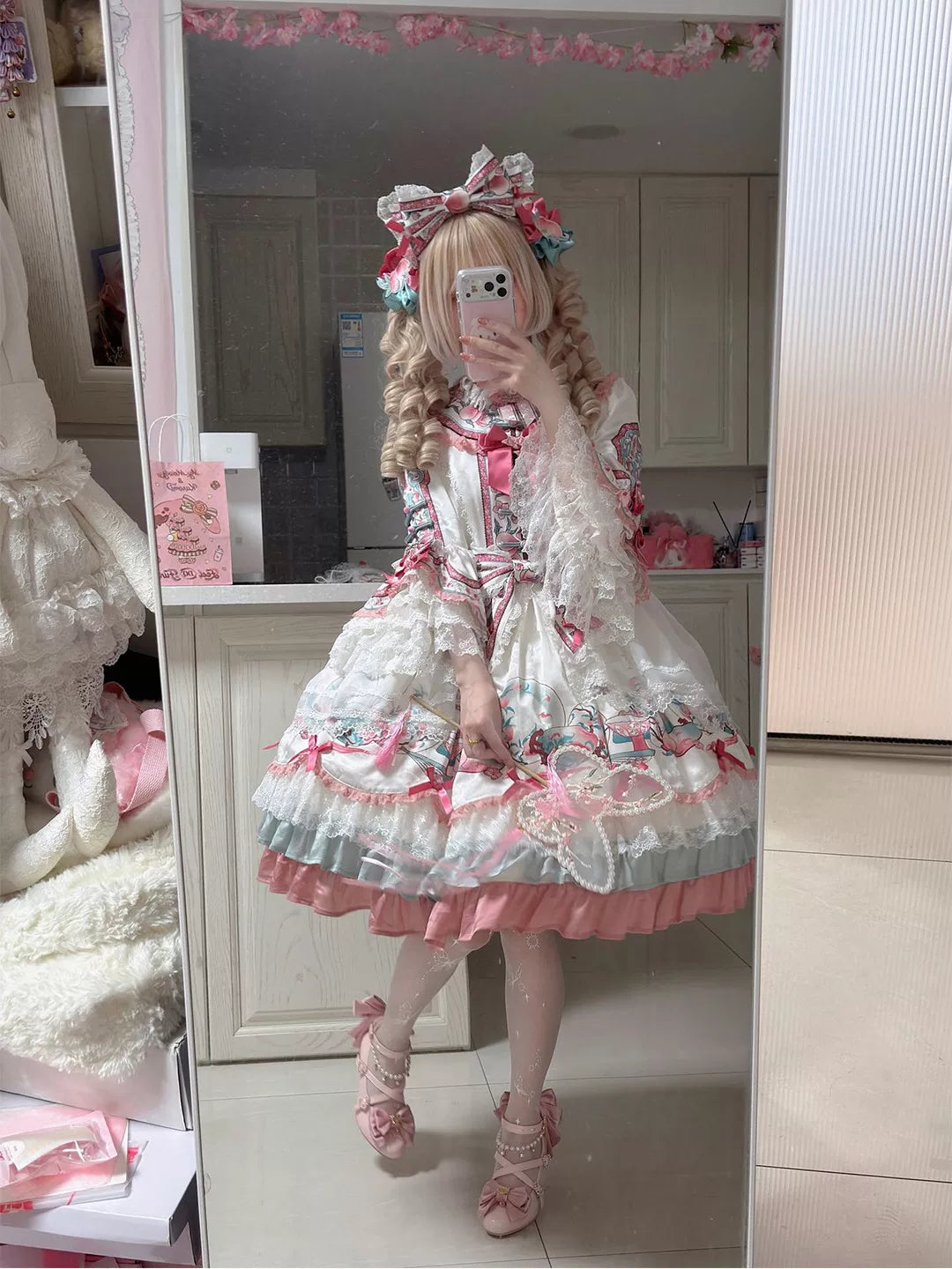 Creamy pink-and-white Chinese-inspired princess dress with peach motifs, bows and layered lace trim.