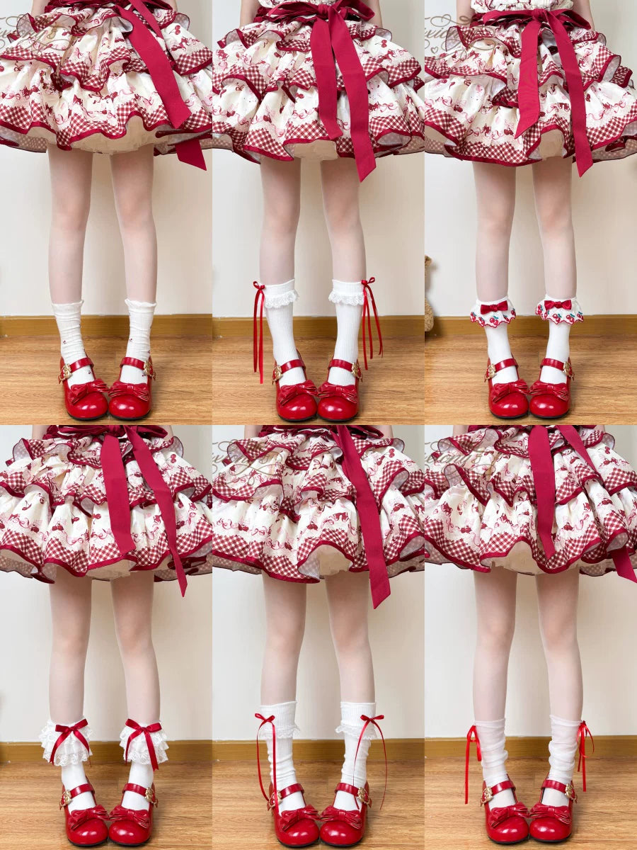 Red-and-white socks with lace, ribbon and bow details shown with red shoes.
