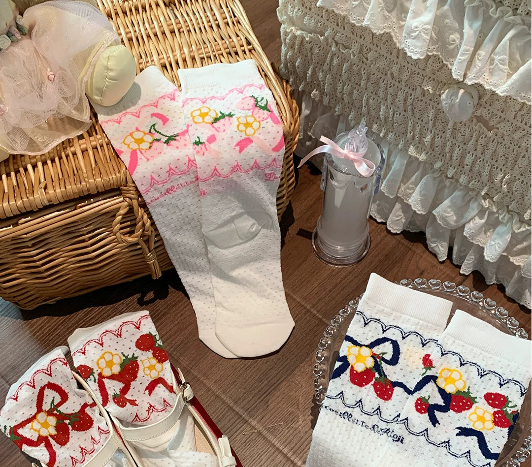 Rose-pink cotton short socks with strawberry, flower, bow and lace details.