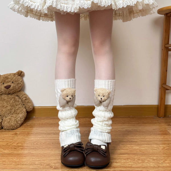 Off-white Chubby Bear Tales cable-knit leg warmers with teddy bear bow accents.