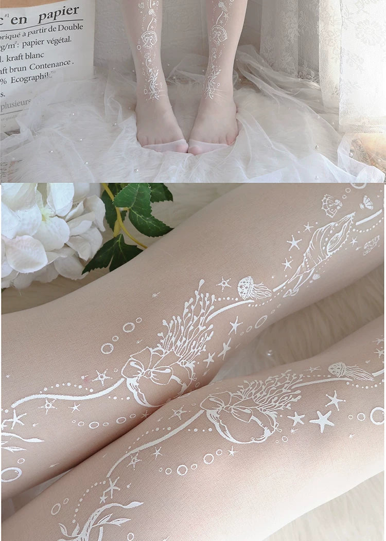 Model wearing white printed tights with fine sea-themed linework beneath a pale skirt.