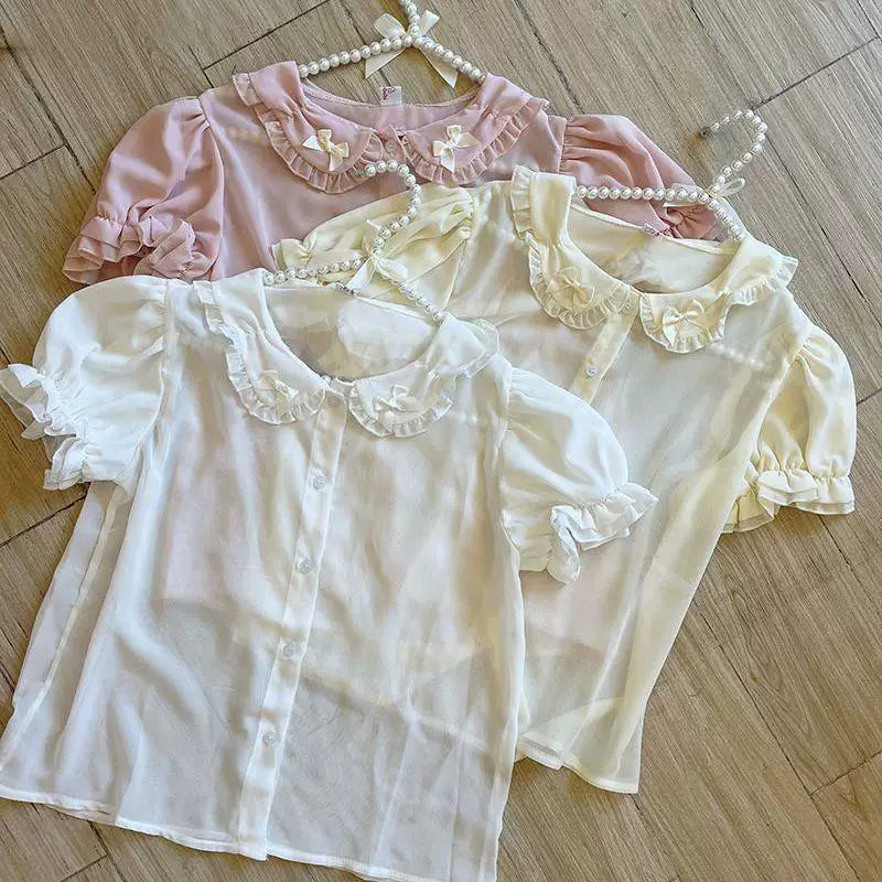 Sweetheart Dream Machine short-sleeve blouses with ruffled Peter Pan collars in white, apricot, and pink