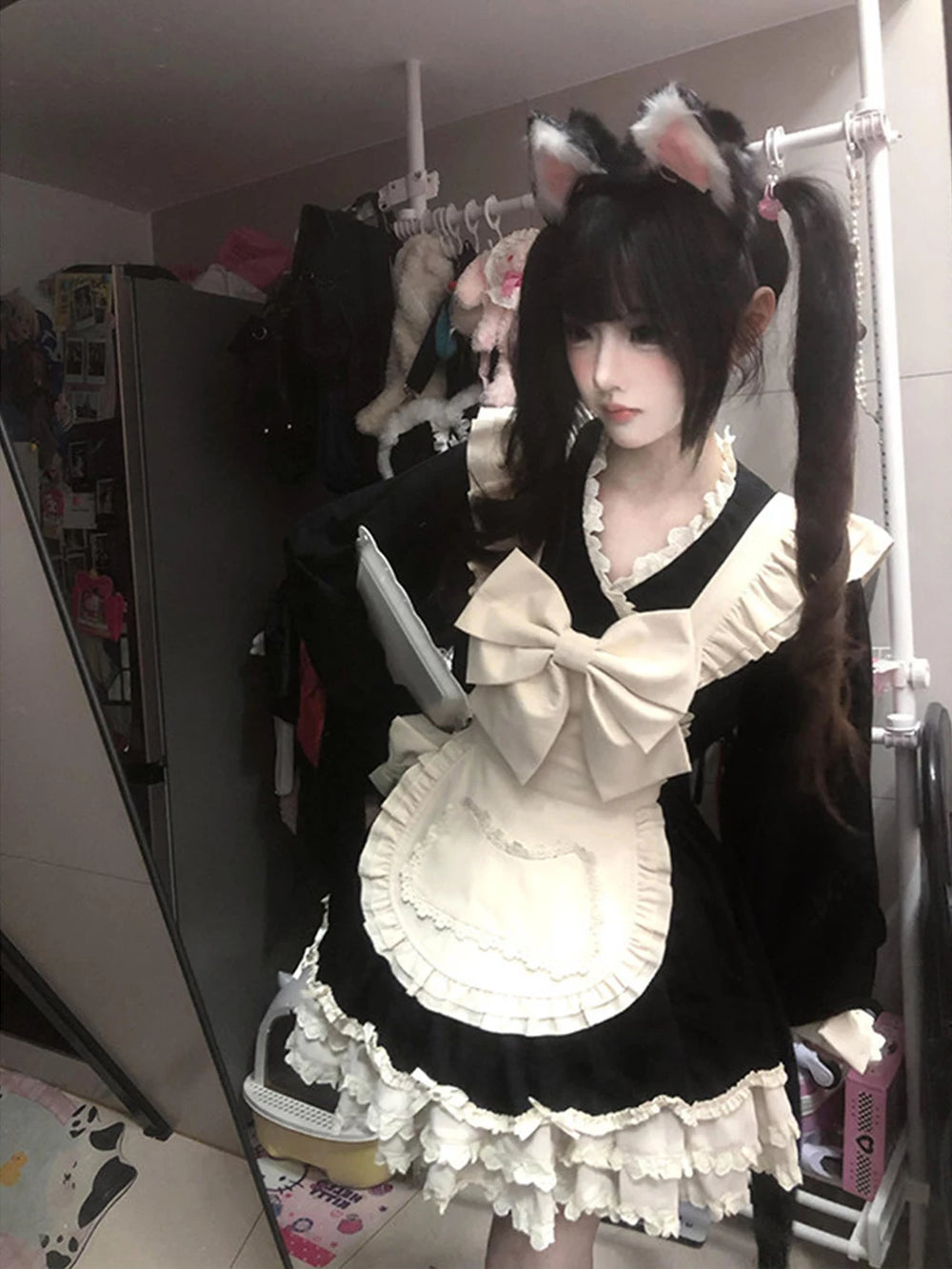 Creamy black-and-white maid OP dress with oversized bow and apron