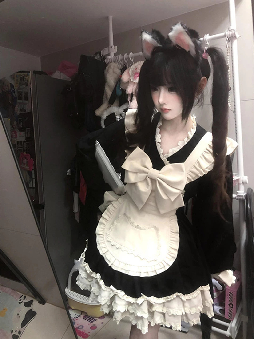 Creamy black-and-white maid OP dress with oversized bow and apron