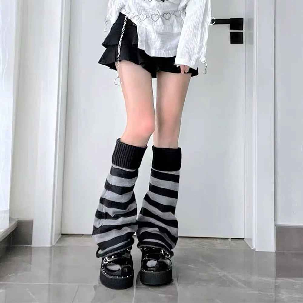 Black-gray striped leg warmers with ribbed cuffs styled with black platform shoes