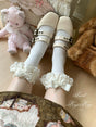 Chaussettes ivoire avec des nœuds ivoire clair
