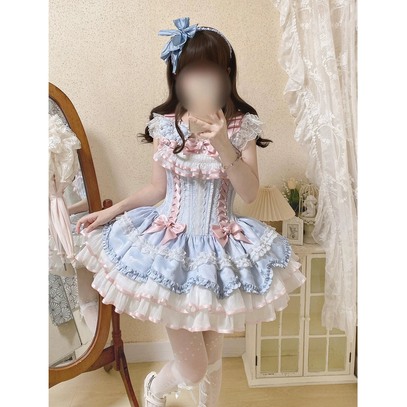 Front view of the JSK dress showing corset front lacing and bow embellishments