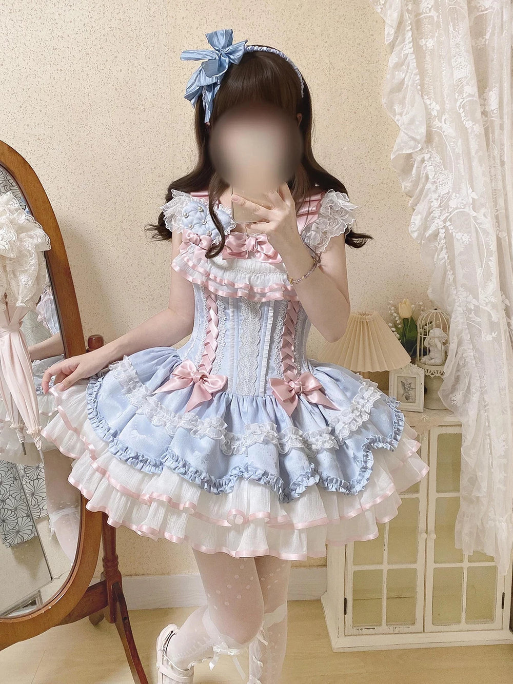 Pale blue sweet lolita JSK dress with satin ribbon bows and tiered ruffled skirt