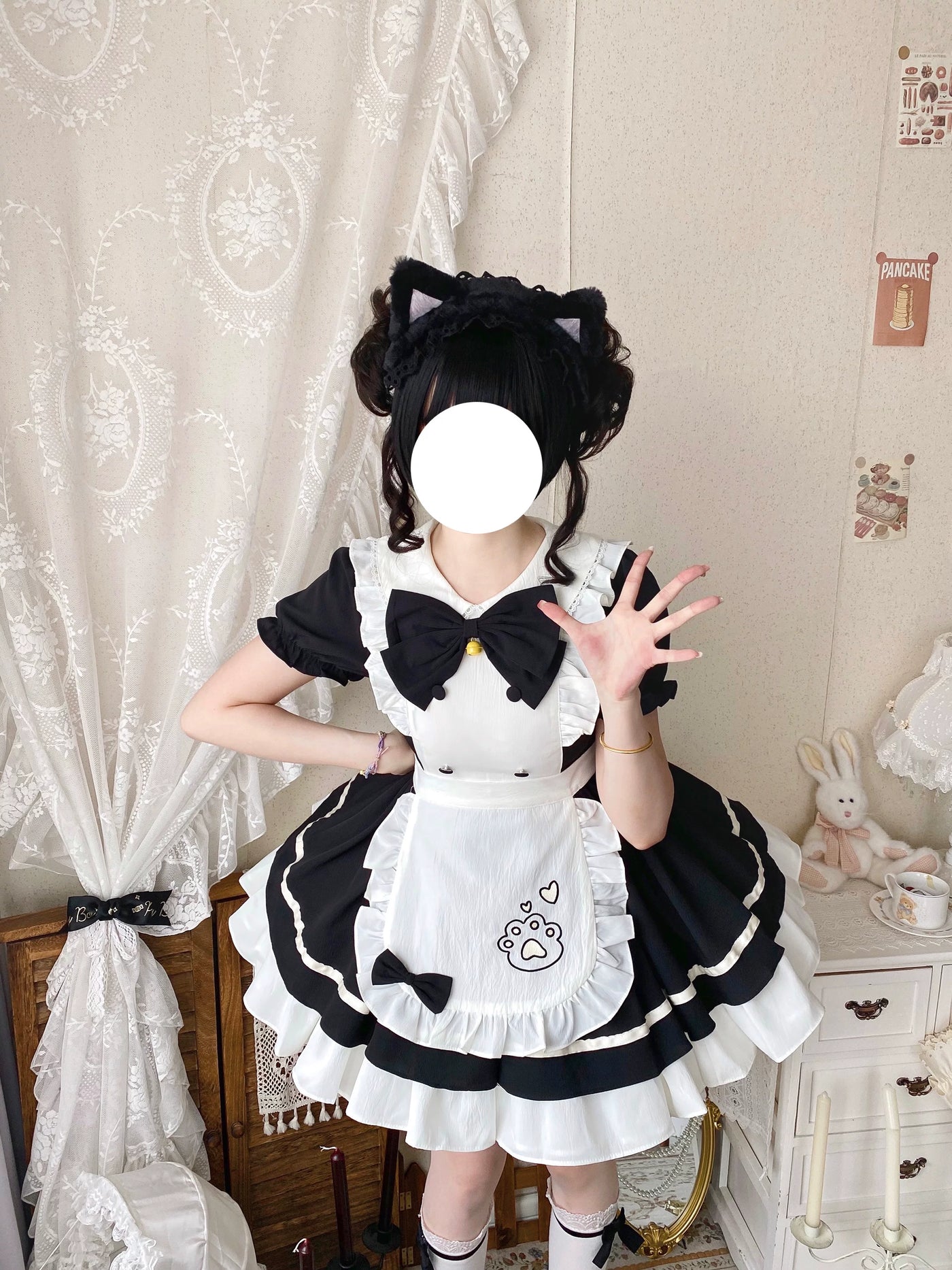 Black-and-white OP dress with a white ruffled apron and large bow