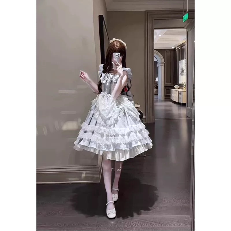 Blue-and-white ruffled Lolita dress with puff sleeves and a train.