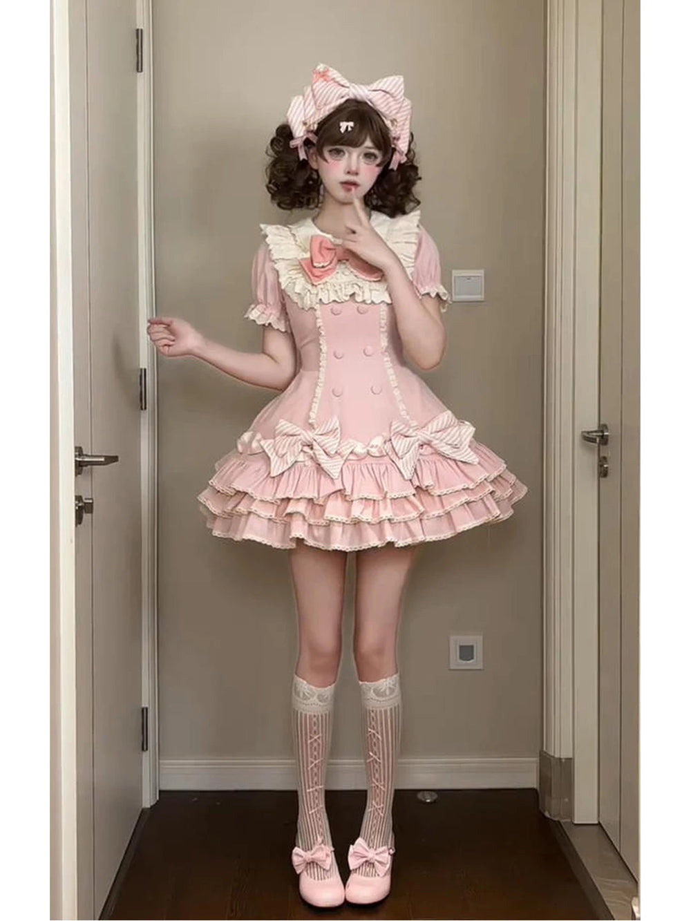 Pink striped tiered Sweet Lolita dress with a bow headpiece