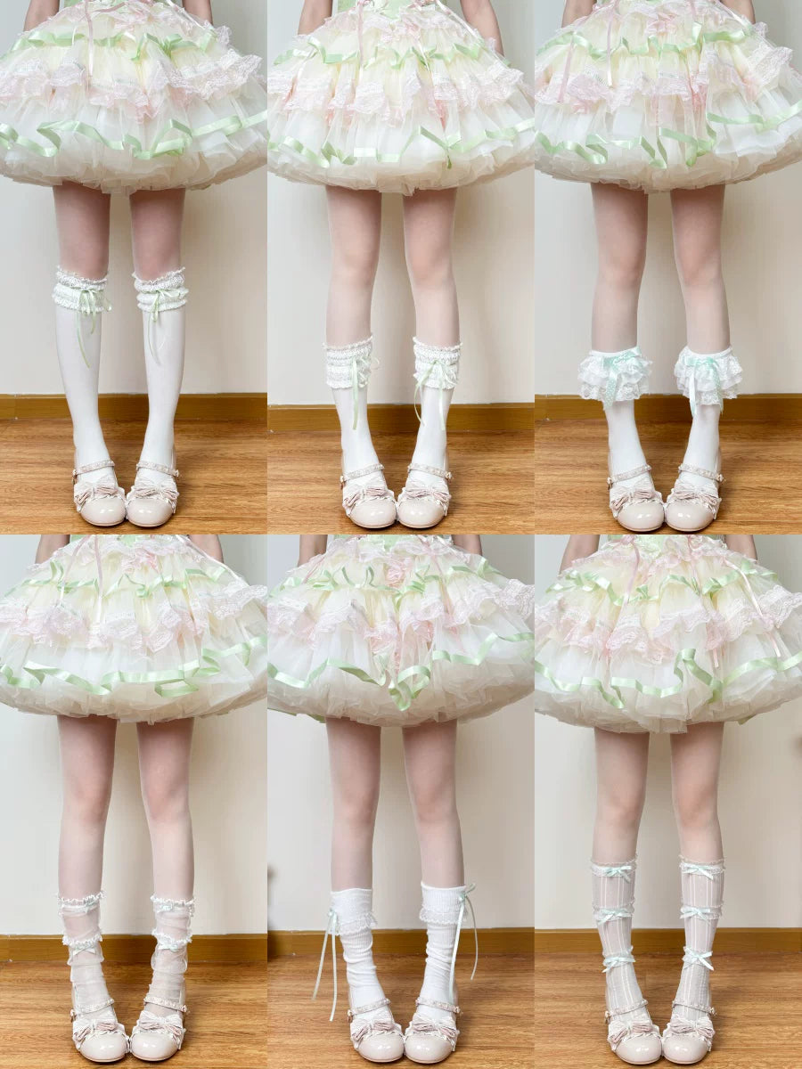 Green-and-white socks and legwear options with bows, lace and layered finishes.