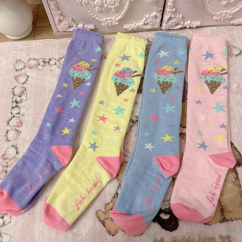 Pastel socks with ice-cream cones and multicolored stars arranged in several colorways.