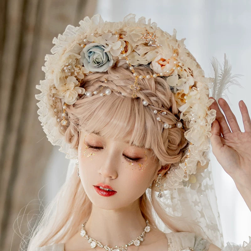Apricot Lolita hat with dotted veil, flowers and feather accents