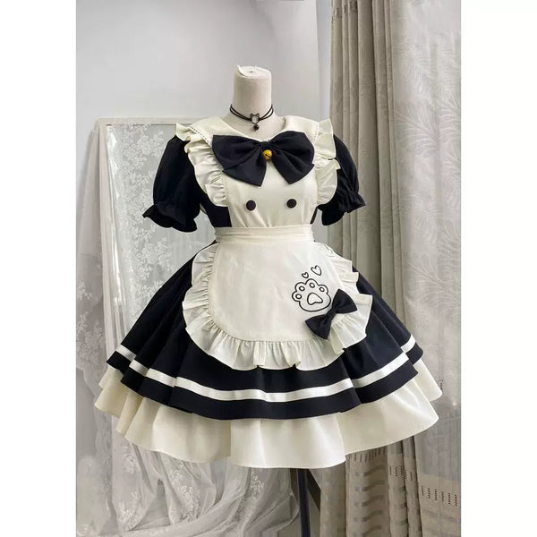 Blue-pink sweet Lolita maid OP dress with short puffed sleeves, ruffled apron with paw print, and tiered skirt, styled with cat-ear headband.