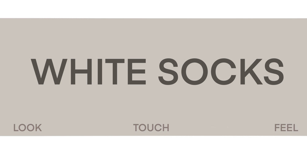 Lace-trimmed white mid-calf socks styled with metallic Mary Jane shoes