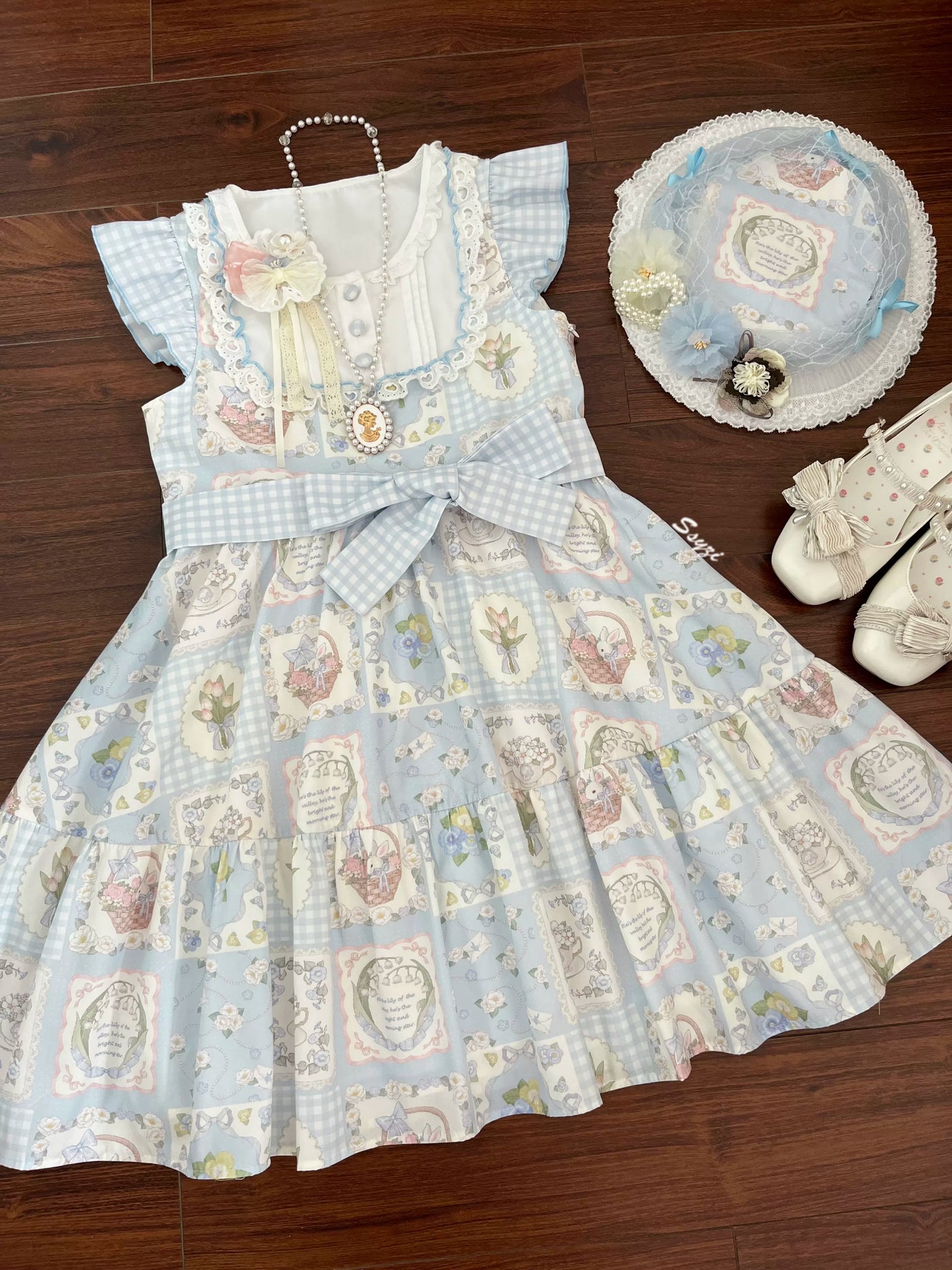 Blue Sweet Lolita one-piece dress with scalloped flutter sleeves, gingham check skirt, and floral print details