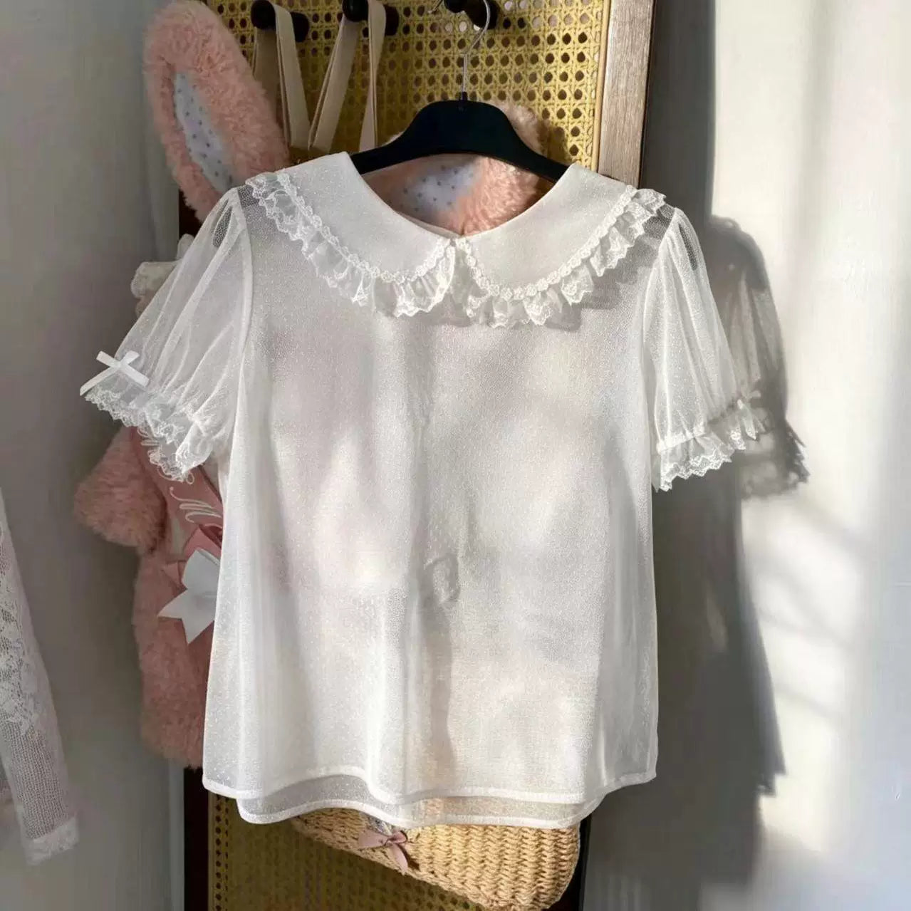 Apricot dotted blouse with a doll collar and lace-trimmed puff sleeves