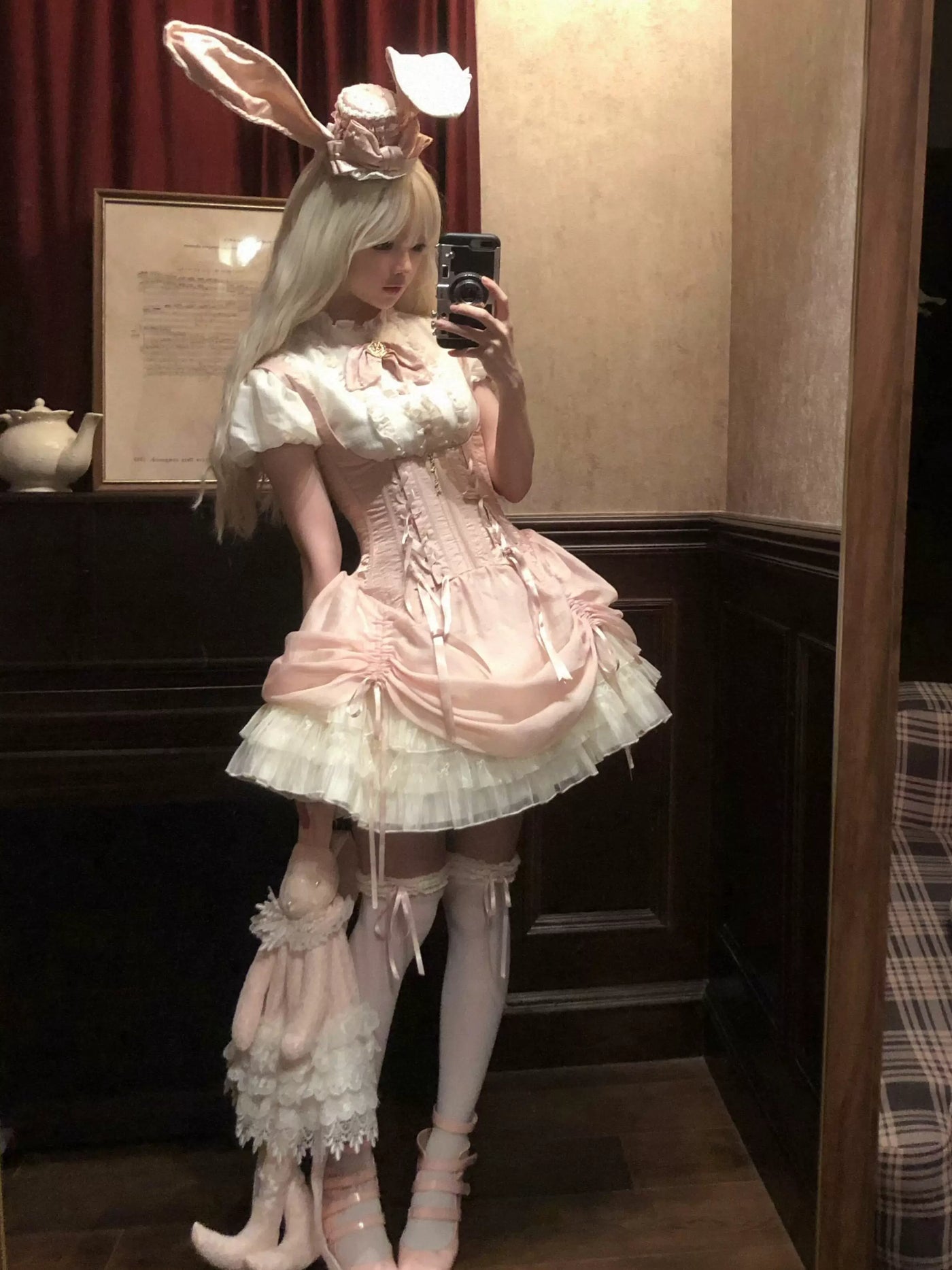 Modelled pink Gothic JSK dress set with a rabbit-ear hat