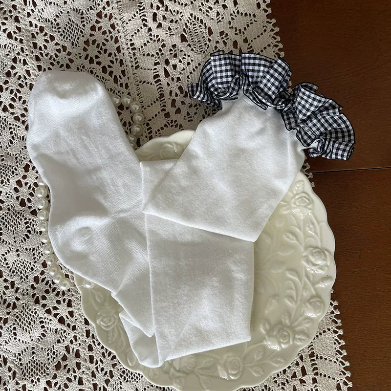Sock Noble check-pattern over-the-knee socks with ruffle tops and a fluffy bunny leg ring