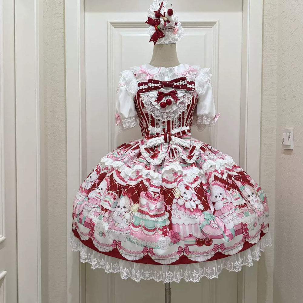 Red printed JSK with layered white lace and ribbon bows shown on a model.