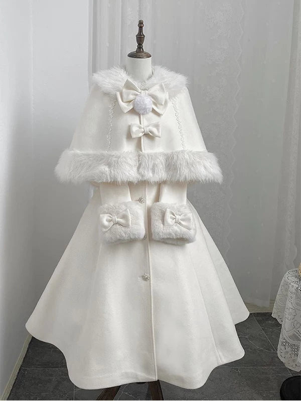 White cape and mid-length coat with fluffy trim and bows