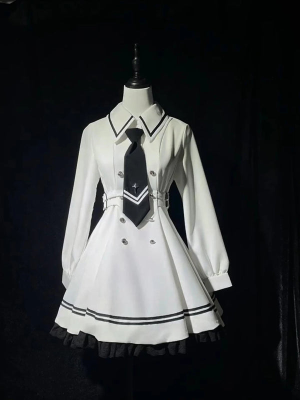 White OP dress and cape set with black piping displayed on a mannequin