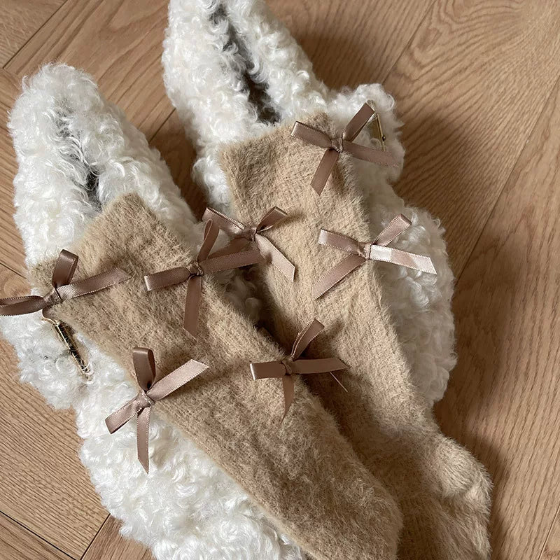 White fluffy mid-calf slouch socks with ribbon bows and pom-pom trim