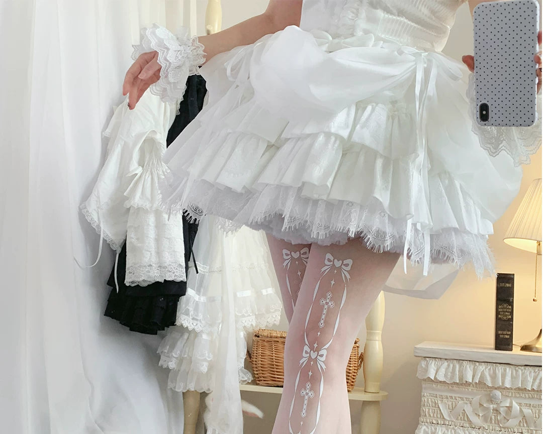 White pantyhose with vertical cross and bow motifs styled beneath a ruffled skirt.